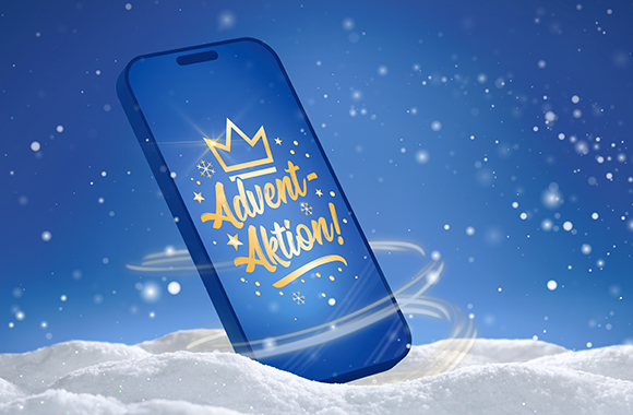 Smartphone mit Schriftzug Adventaktion im Schnee